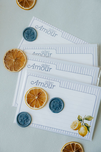 Set of cards with 'Avec Amour' text and decorative elements on a light background