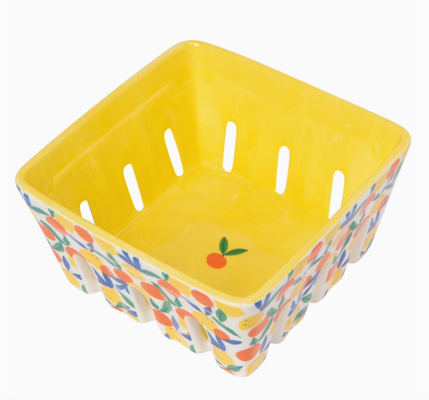 Yellow ceramic basket with floral pattern on a white background